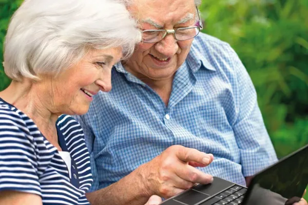 Couple using laptop